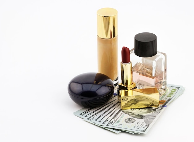 Makeup and cosmetic set on dollar bills