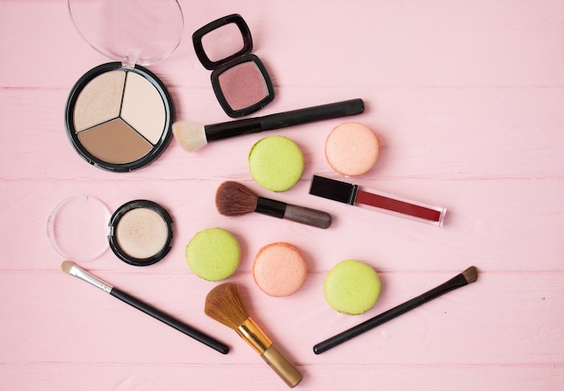 Makeup cosmetics, brushes and other essentials . Top view, flat lay. Multicolored beauty tools and products collection, lipsticks, eyeshadow, mascara and more