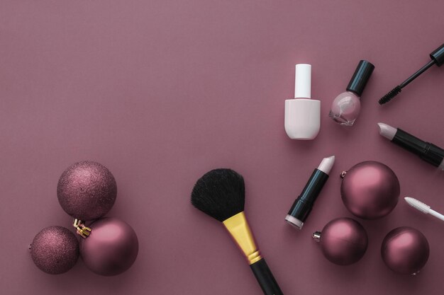 Makeup and cosmetics product set for beauty brand Christmas sale promotion luxury purple flatlay background as holiday design