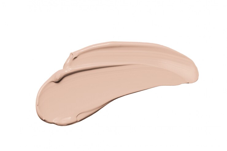 Photo makeup foundation, beige concealer smudge isolated on white