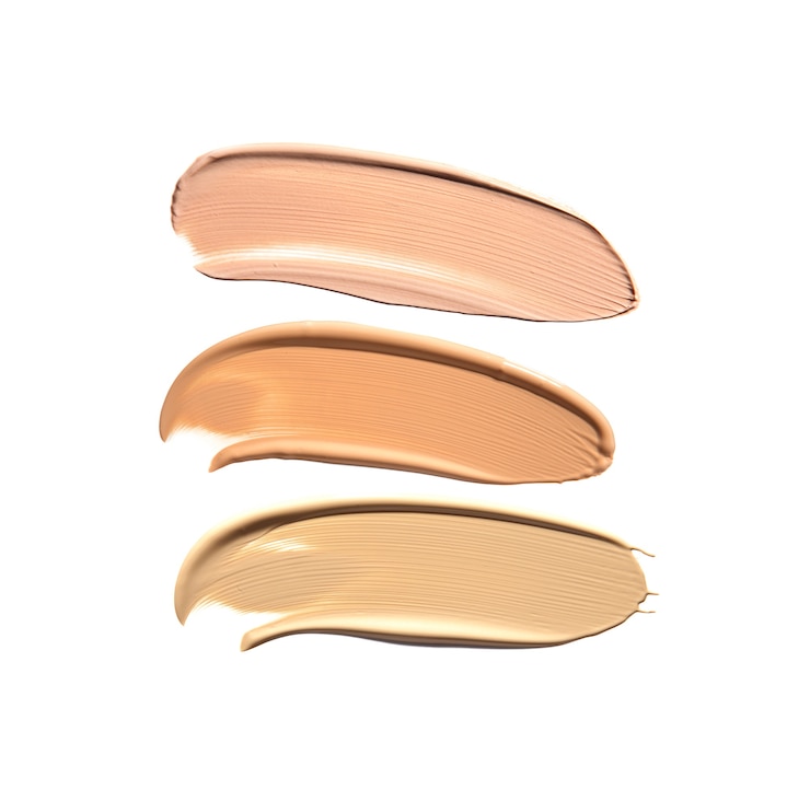 Photo makeup foundation strokes in different shades isolated on white