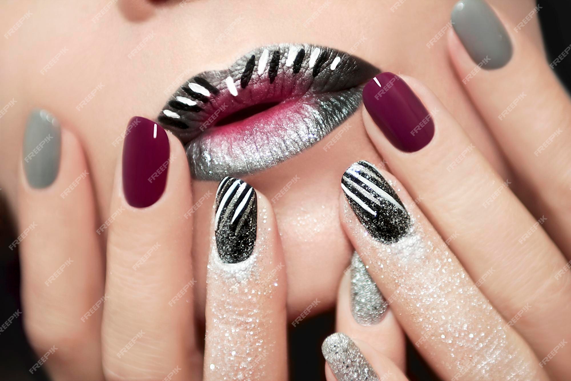 Premium Photo  Makeup and manicure gray striped with burgundy nail polish