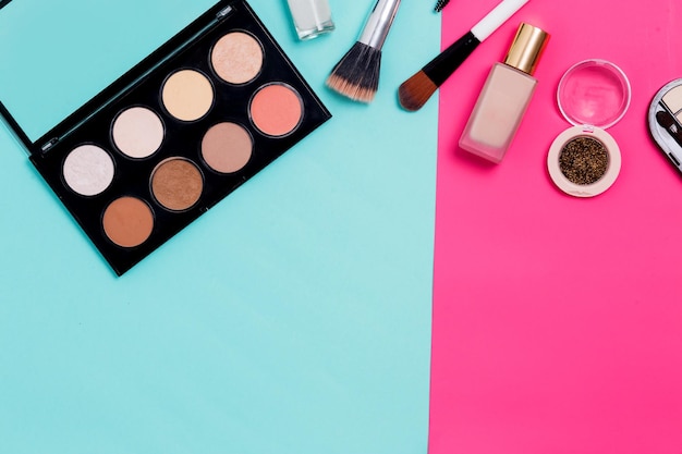 Makeup products, cosmetic on colorful background with copy space, top view