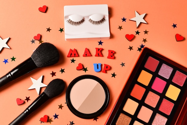 Makeup products with cosmetic beauty products,  eye shadows, eye lashes, brushes and tools