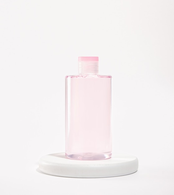 Makeup remover micellar water on a round white stand Natural skin beauty treatment