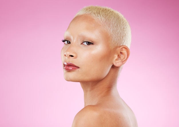 Makeup retro and portrait of a woman with cosmetics isolated on a pink background in studio Beauty mockup and face of a cool vintage model with edgy stylish and classy glamour on a backdrop