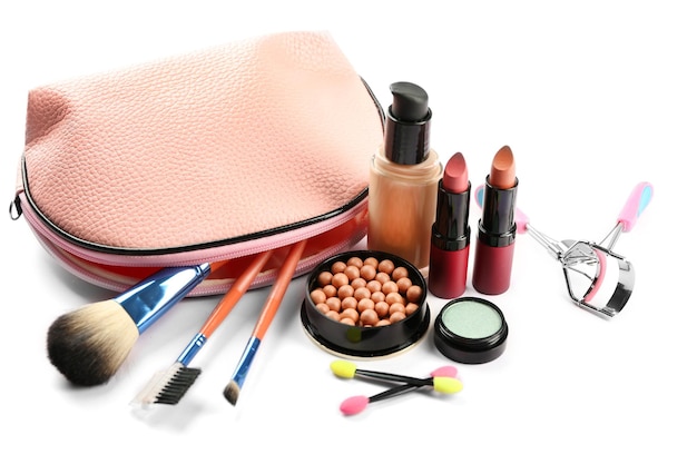 Makeup set with beautician eyelash curler brushes and cosmetics on white background