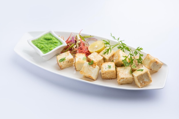Makhmali or Malai Paneer Tikka Kabab is a north indian starter food served with green salad and chutney