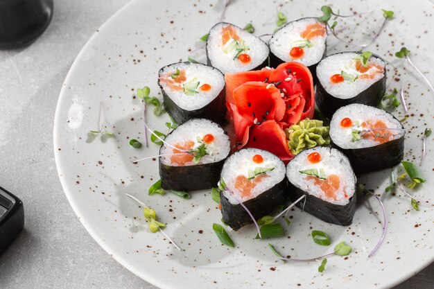 Maki rolls with salmon, cucumber, caviar and cheese.