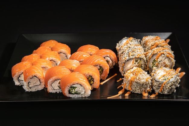 Maki sushi over black background