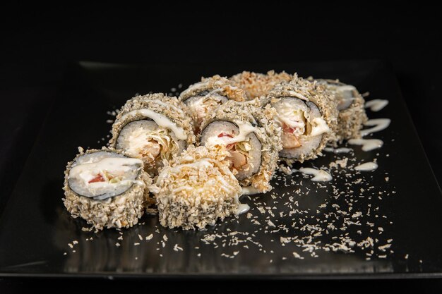 Maki sushi over black background