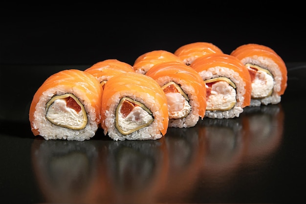 Maki sushi over black background