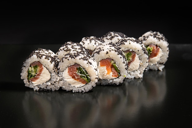 Maki sushi over black background