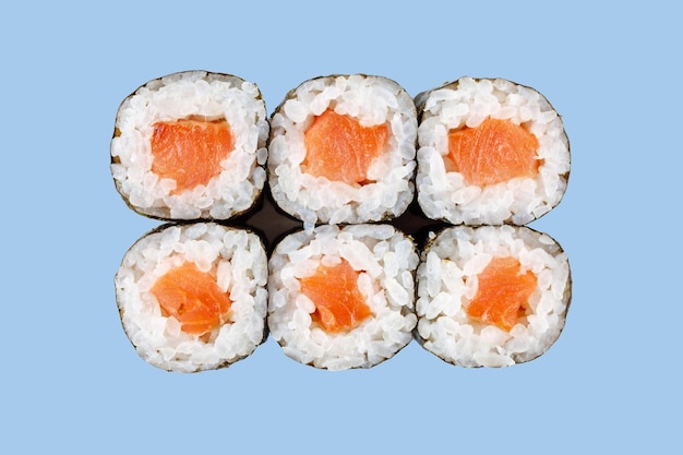 maki with salmon on blue background