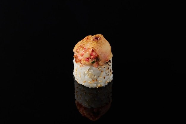 Maki with smoked eel sushi on a black background