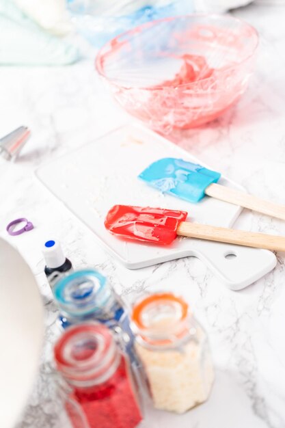 Photo making buttercream frosting for decorating a vanilla cake.