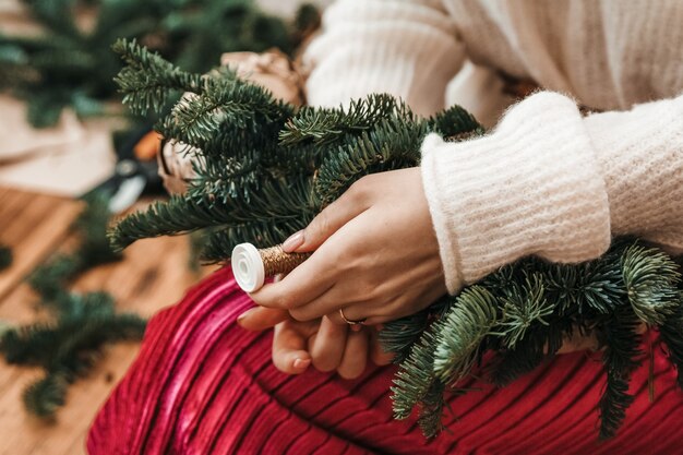 Making of a christmas pine wreath.