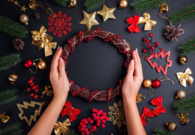 Making a Christmas wreath. Christmas and New Year background