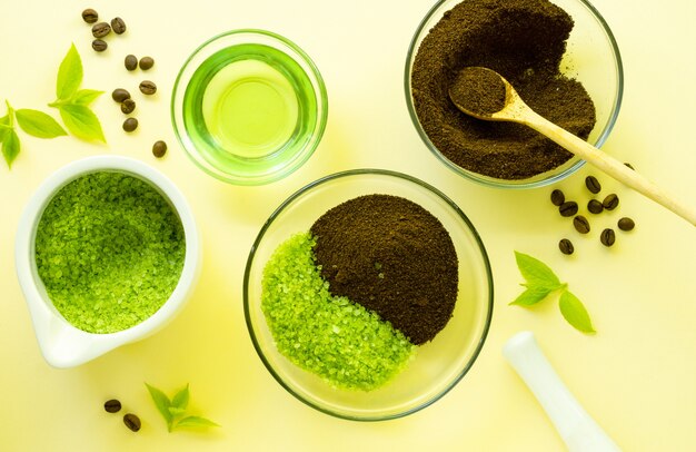 Photo making coffee scrub with sea salt and oil on a light background