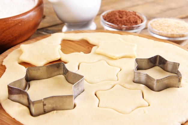 Making cookies on wooden background