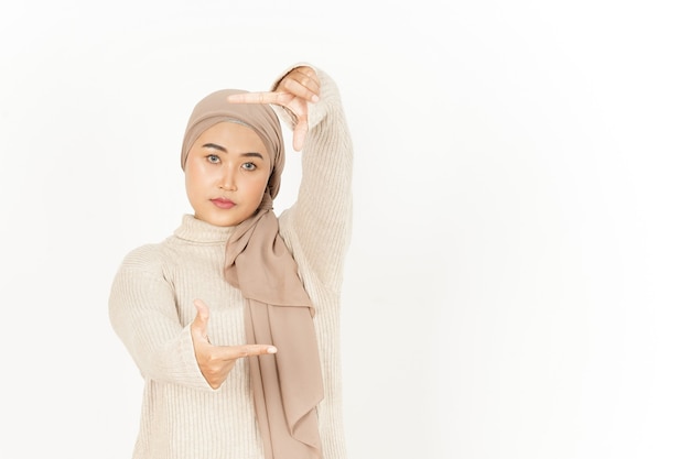 Making Frame with Hands of Beautiful Asian Woman Wearing Hijab Isolated On White Background