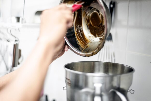 making gelato ice cream with modern equipment in kitchen interior