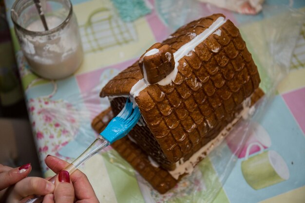 Making a gingerbread house on the kitchen table