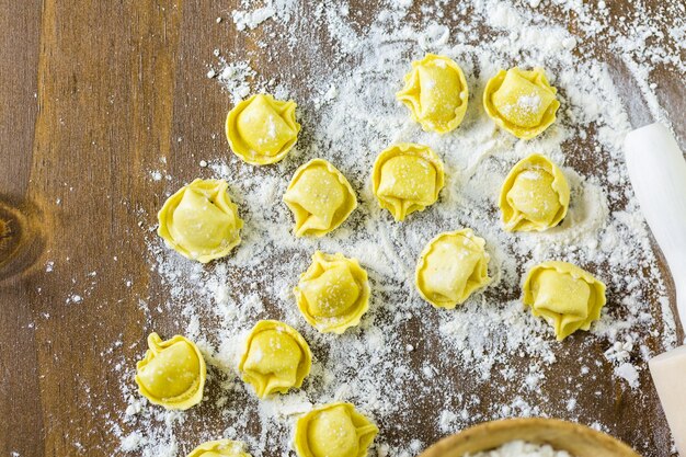 Making homemade four cheese tortellini with farm fresh produce.