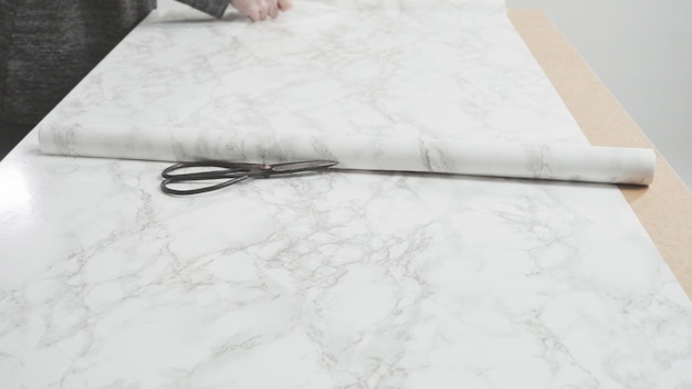 Making marble board with adhesive paper for food photography.