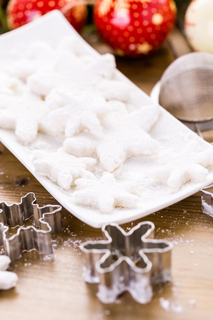 Making marshmallows in shapes of snowflakes for garnish hot chocolate.