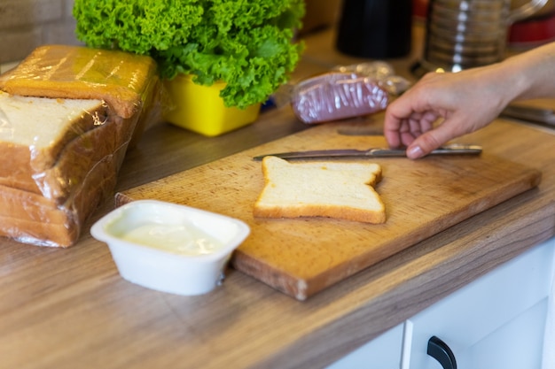 Making morning sandwich at home kitchen copy space