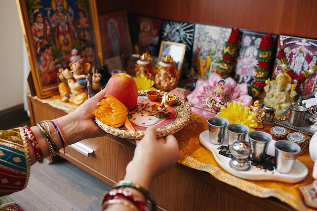 Photo making offerings during praying at altar