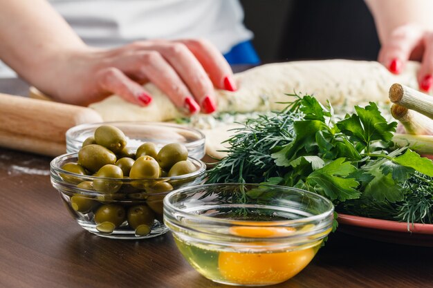 Making olives stuffed french bread