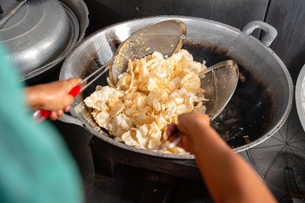 making process Emping Balado Spicy Snacks from West Sumatra Made from melinjo crackers