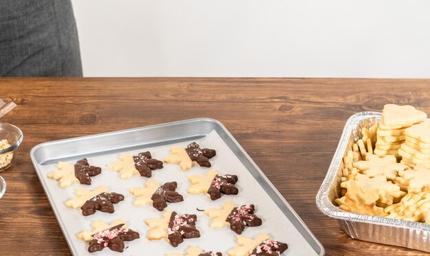 Making starshaped cookies with chocolate and peppermint chips