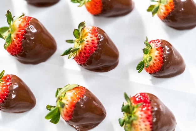 Making white and dark chocolate dipped strawberries