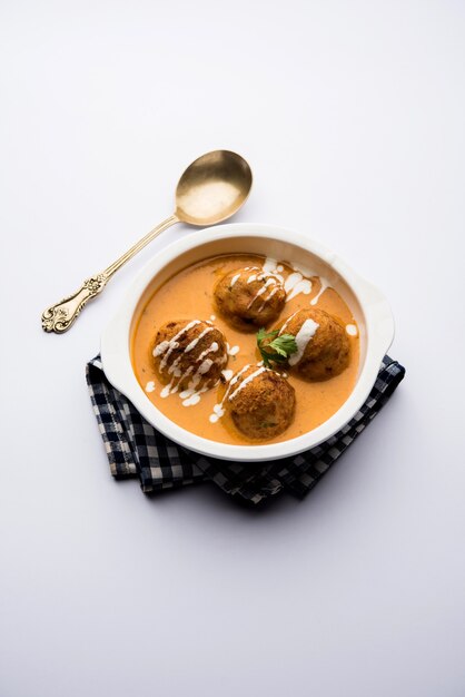 Malai Kofta Curry is a Mughlai special recipe served in a bowl. Selective focus