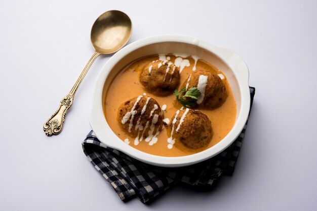 Malai Kofta Curry is a Mughlai special recipe served in a bowl. Selective focus