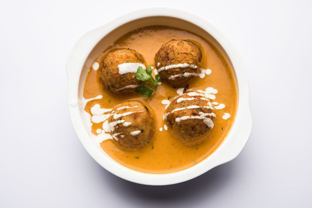 Malai Kofta Curry is a Mughlai special recipe served in a bowl. Selective focus