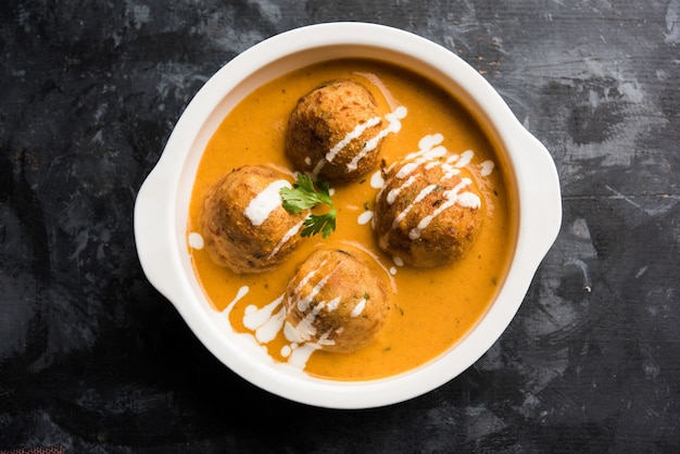 Malai Kofta Curry is a Mughlai special recipe served in a bowl. Selective focus