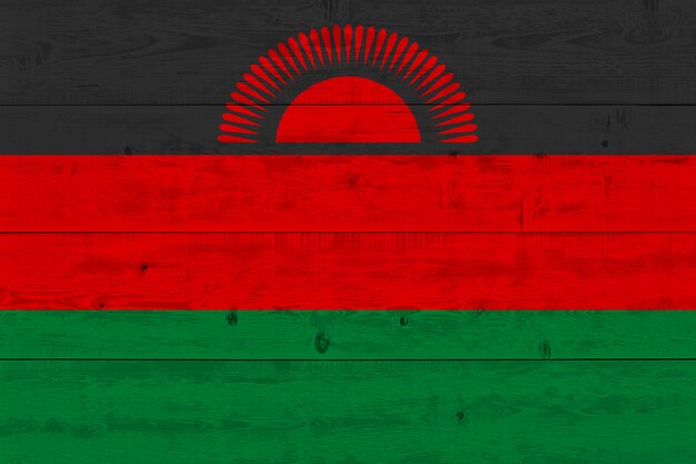 Malawi flag painted on old wood plank