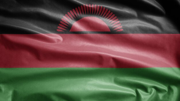 Malawian flag waving in the wind. Malawi banner blowing soft silk