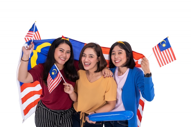 Malay girl holding malaysia national flag