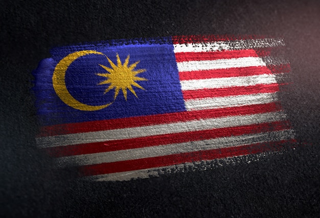 Malaysia Flag Made of Metallic Brush Paint on Grunge Dark Wall