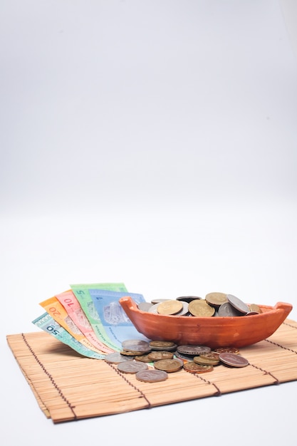 Malaysia Ringgit note and coins isolated on white background.