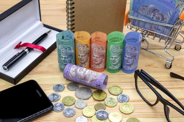 Malaysian ringgit banknotes on wooden table