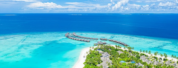 Maldives paradise. Tropical aerial landscape, seascape with water villas pier, dreamy sea lagoon