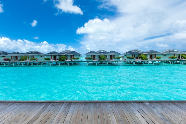 Maldives water bungalow on ocean water landscape