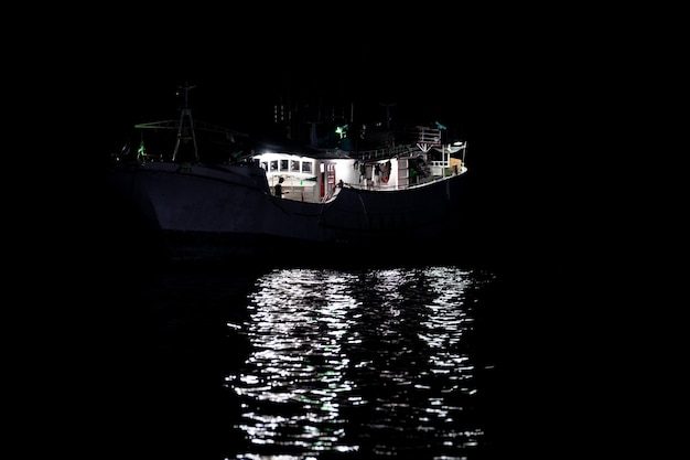 Maldivian fishing boat in maldives at night