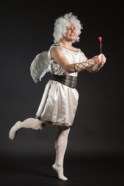 Male angel Cupid with a love heart. Valentine's day